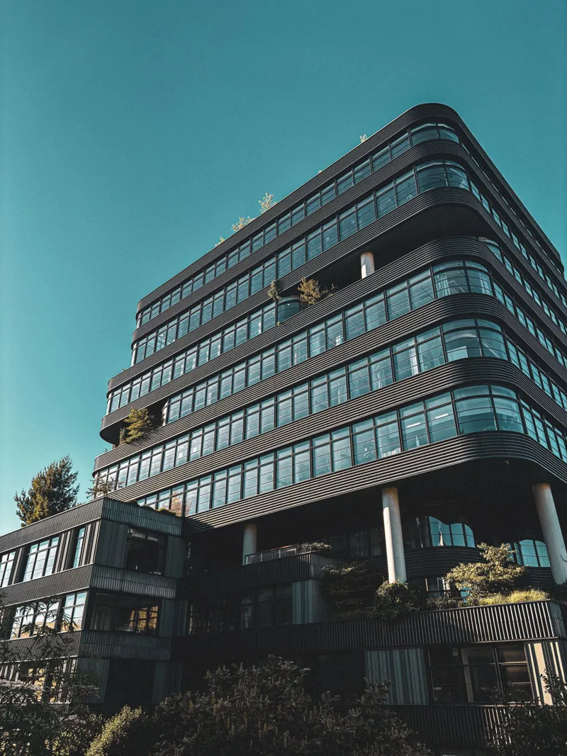 A modern office building with a curved glass front
